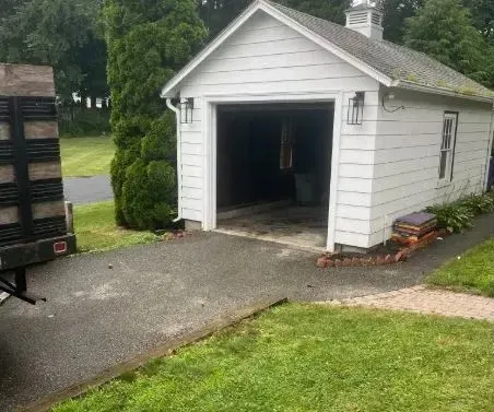 A junk free garage with green and clean outside